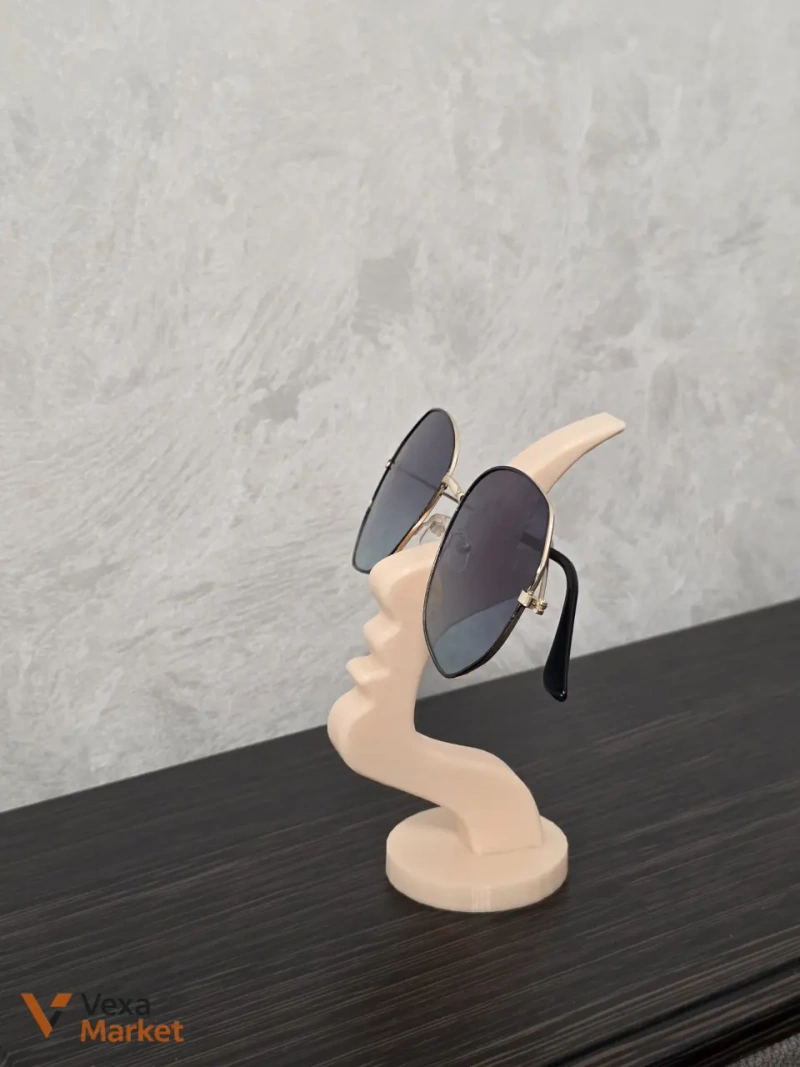 3D-печатная подставка для очков в форме абстрактного профиля лица — фото 2
