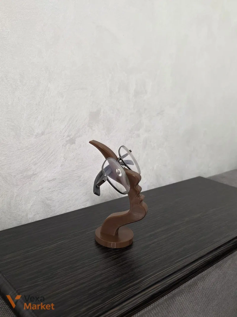 3D-печатная подставка для очков в форме абстрактного профиля лица — фото 3