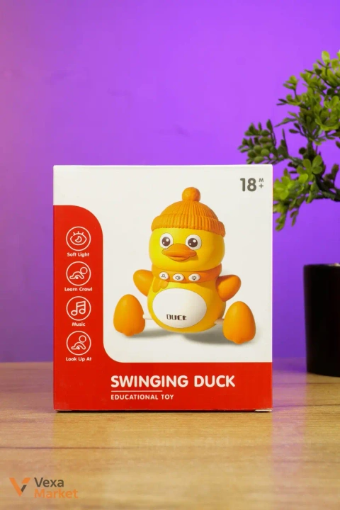 Музична іграшка-каченя "Swinging Duck" YL 503, що рухається та співає