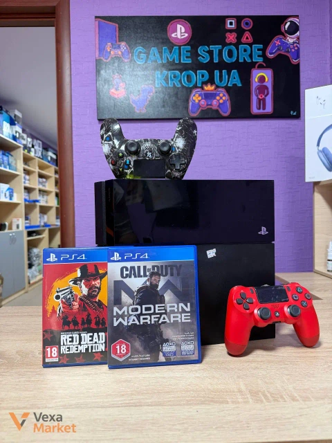 Ігрова приставка Sony PlayStation 4 з двома дисками з іграми та двома геймпадами