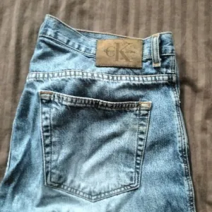 Широкі штани Calvin Klein розмір 34 сині